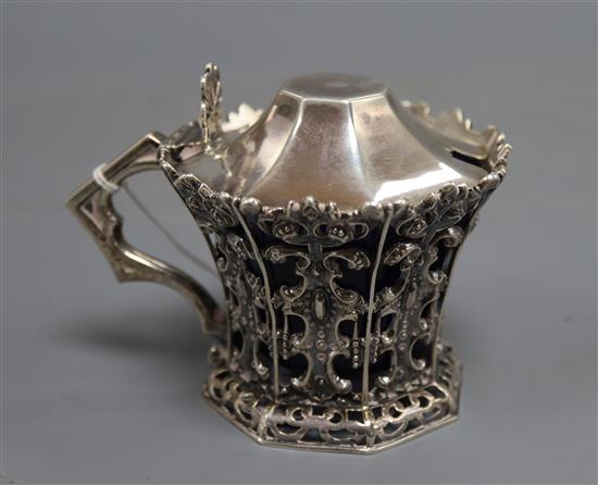 A Victorian pierced silver mustard, with flared rim and blue glass liner, J & J Angell, London, 1846, height 8cm, 4.5 oz.